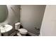 Bathroom with a white pedestal sink and a toilet at 1867 Holden Ridge Lane, Clermont, FL 34715