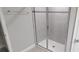 Shower with sliding glass doors and a gray tiled wall at 1867 Holden Ridge Lane, Clermont, FL 34715