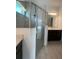 Stylish bathroom featuring a glass shower and neutral color palette at 2324 Juniper Berry Dr, Minneola, FL 34715