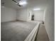 Clean and spacious two-car garage with lighting at 2324 Juniper Berry Dr, Minneola, FL 34715