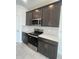 Close up view of the modern kitchen featuring stainless steel appliances and white countertops at 2324 Juniper Berry Dr, Minneola, FL 34715