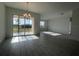Bright living room featuring sliding glass doors leading to a view of the outdoor scenery at 2324 Juniper Berry Dr, Minneola, FL 34715