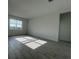 Bright, open living room with a window view and tile flooring at 2324 Juniper Berry Dr, Minneola, FL 34715