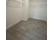Walk-in closet with shelving and tile flooring at 2324 Juniper Berry Dr, Minneola, FL 34715