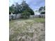 Wide view of a backyard with grass and wood fence at 2947 Aldrich St, Eustis, FL 32726