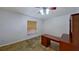 Bright room features tile floors, desk, ceiling fan, and a window with blinds at 2947 Aldrich St, Eustis, FL 32726