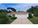 Charming single-story home features a two-car garage and a well-maintained lawn at 2947 Aldrich St, Eustis, FL 32726