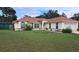 Well-maintained single-story home features a large front yard and an attached two-car garage at 2947 Aldrich St, Eustis, FL 32726