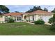 Attractive single-story home with well-manicured lawn and meticulous landscaping at 2947 Aldrich St, Eustis, FL 32726