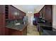 Stylish kitchen featuring granite countertops, stainless steel appliances, and dark wood cabinetry at 2947 Aldrich St, Eustis, FL 32726