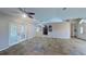 Expansive living room featuring tile flooring, neutral decor, and a ceiling fan at 2947 Aldrich St, Eustis, FL 32726