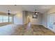 Open-concept living room featuring neutral walls, tile floors, and ceiling fans at 2947 Aldrich St, Eustis, FL 32726