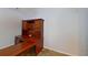 Office room with a wooden desk and tan tile flooring under neutral painted walls at 2947 Aldrich St, Eustis, FL 32726