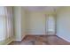 A room with neutral walls, tile flooring, and windows fitted with cellular shades and curtains at 2947 Aldrich St, Eustis, FL 32726