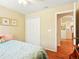 Comfortable bedroom with a closet, ensuite doorway, and light-colored walls at 5317 Butterfly Ct, Leesburg, FL 34748