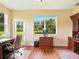 Spacious home office with hardwood floors, nice view, and classic wooden furniture at 5317 Butterfly Ct, Leesburg, FL 34748