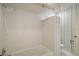 Bathroom featuring a tiled shower/tub, toilet, and vanity area at 9335 Silver Lake Dr, Leesburg, FL 34788