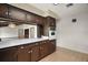 Kitchen featuring cabinets, countertops, appliances, and serving hatch at 9335 Silver Lake Dr, Leesburg, FL 34788