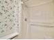 Shower stall featuring a single shower head with white walls and an assist bar at 9335 Silver Lake Dr, Leesburg, FL 34788