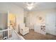 Light-filled Bedroom with ceiling fan, closet, and adjacent bathroom at 4904 Sw 45Th St, Ocala, FL 34474