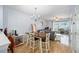 Cozy dining area leading to the living room with sliding glass doors to the patio at 4904 Sw 45Th St, Ocala, FL 34474