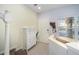 Welcoming foyer featuring a staircase, tiled flooring, and stylish storage furniture at 4904 Sw 45Th St, Ocala, FL 34474