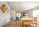 Bright dining area with decorative wall, which flows seamlessly into the living room and modern kitchen at 9200 Se 48Th Court Rd, Ocala, FL 34480