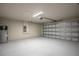 Large garage with a garage door opener and storage at 9200 Se 48Th Court Rd, Ocala, FL 34480