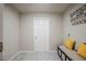 Mud room with a storage bench and grey tile flooring at 9200 Se 48Th Court Rd, Ocala, FL 34480