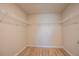 Empty walk-in closet features wire shelving and wood-look floors at 9200 Se 48Th Court Rd, Ocala, FL 34480