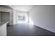 Living room with an attached kitchen featuring granite countertops at 700 Fisher Rd, Ocklawaha, FL 32179