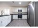 Well-equipped kitchen with granite countertops, stainless steel appliances, and plenty of cabinet space at 781 Ne 130Th Ter, Silver Springs, FL 34488