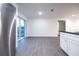 Open kitchen and dining area featuring stainless steel appliances, granite countertops, and sliding glass door at 781 Ne 130Th Ter, Silver Springs, FL 34488