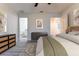 Relaxing main bedroom with gray dresser and view of ensuite bathroom at 781 Ne 130Th Ter, Silver Springs, FL 34488