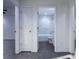 Bathroom with white marble-tiled shower, bathtub, and a doorway leading to the bedroom at 1243 Ne 130Th Ter, Silver Springs, FL 34488