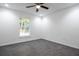 Bright bedroom featuring a ceiling fan, recessed lights, wood-look floors, and a window with wooded views at 1243 Ne 130Th Ter, Silver Springs, FL 34488