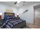 Bedroom with gray bed, wood floors, and board accents at 1243 Ne 130Th Ter, Silver Springs, FL 34488