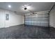 Garage with epoxy flooring and a garage door at 1243 Ne 130Th Ter, Silver Springs, FL 34488