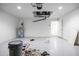 Garage showcasing utilities, epoxy flooring and access door at 1243 Ne 130Th Ter, Silver Springs, FL 34488