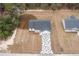 Aerial view showcasing a new home with a unique paved driveway at 13050 Ne 7Th Loop, Silver Springs, FL 34488