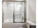 Modern bathroom featuring a luxurious shower, marble tile, and contemporary fixtures at 13050 Ne 7Th Loop, Silver Springs, FL 34488