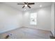 Bedroom with a window showing a clear view, and awaiting final touches before move in at 13050 Ne 7Th Loop, Silver Springs, FL 34488