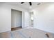 Bright bedroom showing closet and doorway to kitchen area. Awaiting finishing touches at 13050 Ne 7Th Loop, Silver Springs, FL 34488