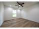 Bedroom featuring new floors, a bright window, and modern recessed lighting at 13050 Ne 7Th Loop, Silver Springs, FL 34488