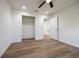 Bright bedroom featuring a spacious closet, new floors, and modern recessed lighting at 13050 Ne 7Th Loop, Silver Springs, FL 34488