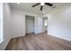 Bedroom featuring new floors, a ceiling fan, and a closet for plenty of storage at 13050 Ne 7Th Loop, Silver Springs, FL 34488