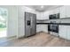 Modern kitchen with white cabinets and stainless steel appliances in a newly renovated home at 13050 Ne 7Th Loop, Silver Springs, FL 34488