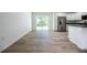 Bright and airy kitchen with stainless steel appliances and sliding glass doors to the backyard at 13050 Ne 7Th Loop, Silver Springs, FL 34488