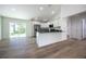 Contemporary kitchen featuring black countertops and an open layout, great for entertaining guests at 13050 Ne 7Th Loop, Silver Springs, FL 34488