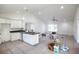 Modern kitchen featuring white cabinetry, sleek countertops, recessed lighting, and an open layout connected to the living area at 13050 Ne 7Th Loop, Silver Springs, FL 34488